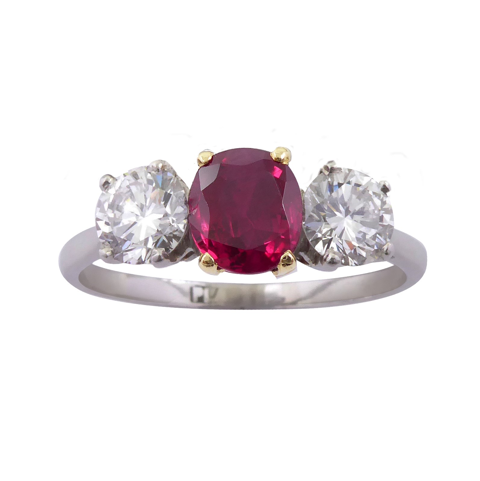 Ruby and diamond three stone ring, claw set with an oval cut Burma ruby